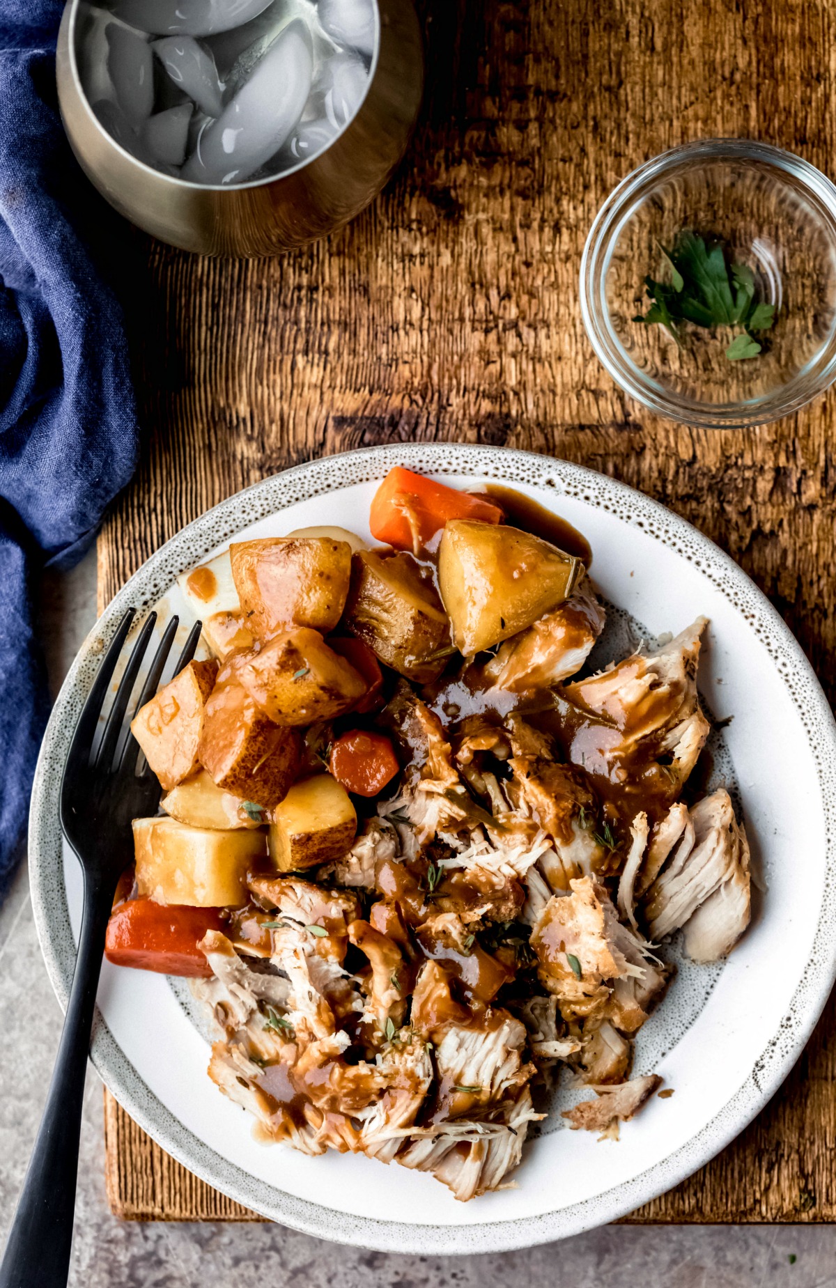Pork roast with gravy carrots and potatoes.