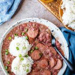 Plate of instant pot red beans and rice topped with two scoops of rice