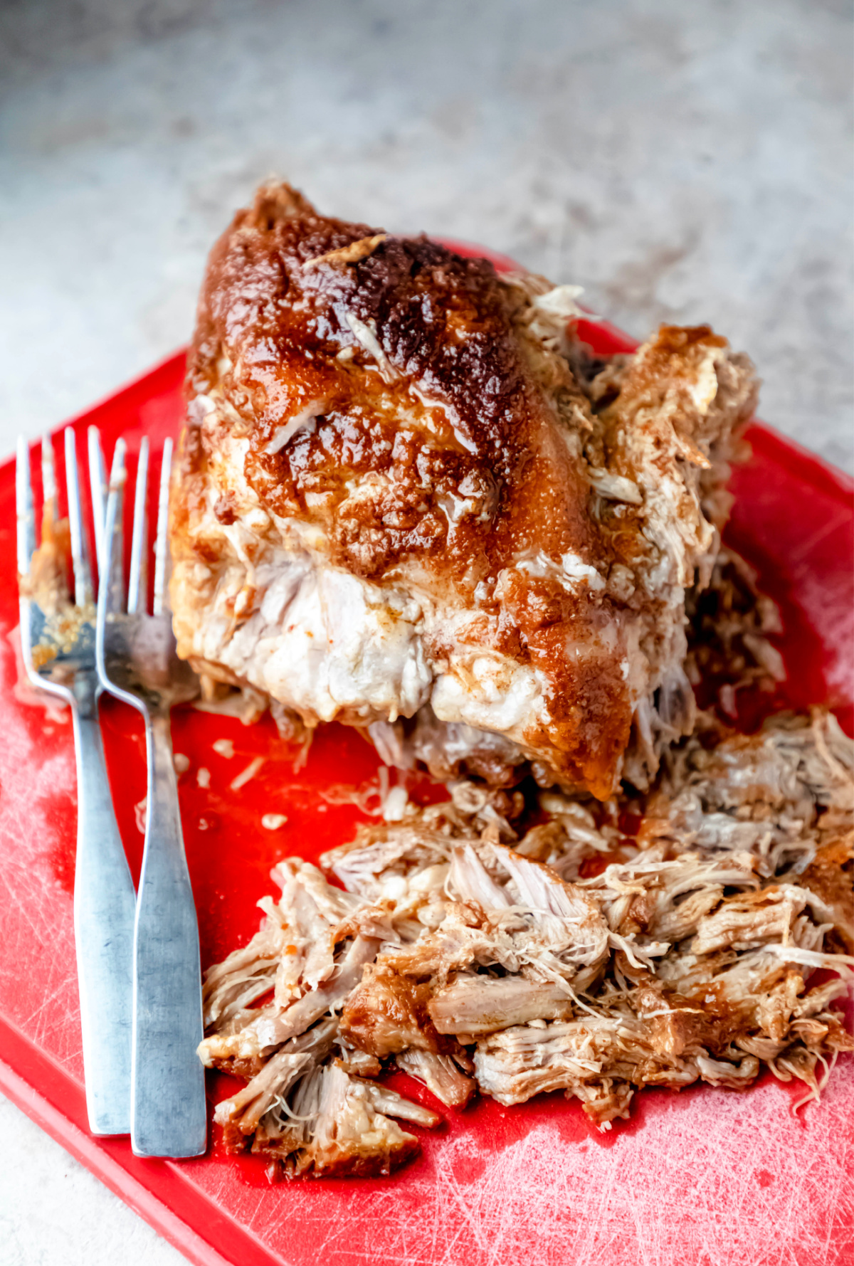 North Carolina style pulled pork on a red cutting board