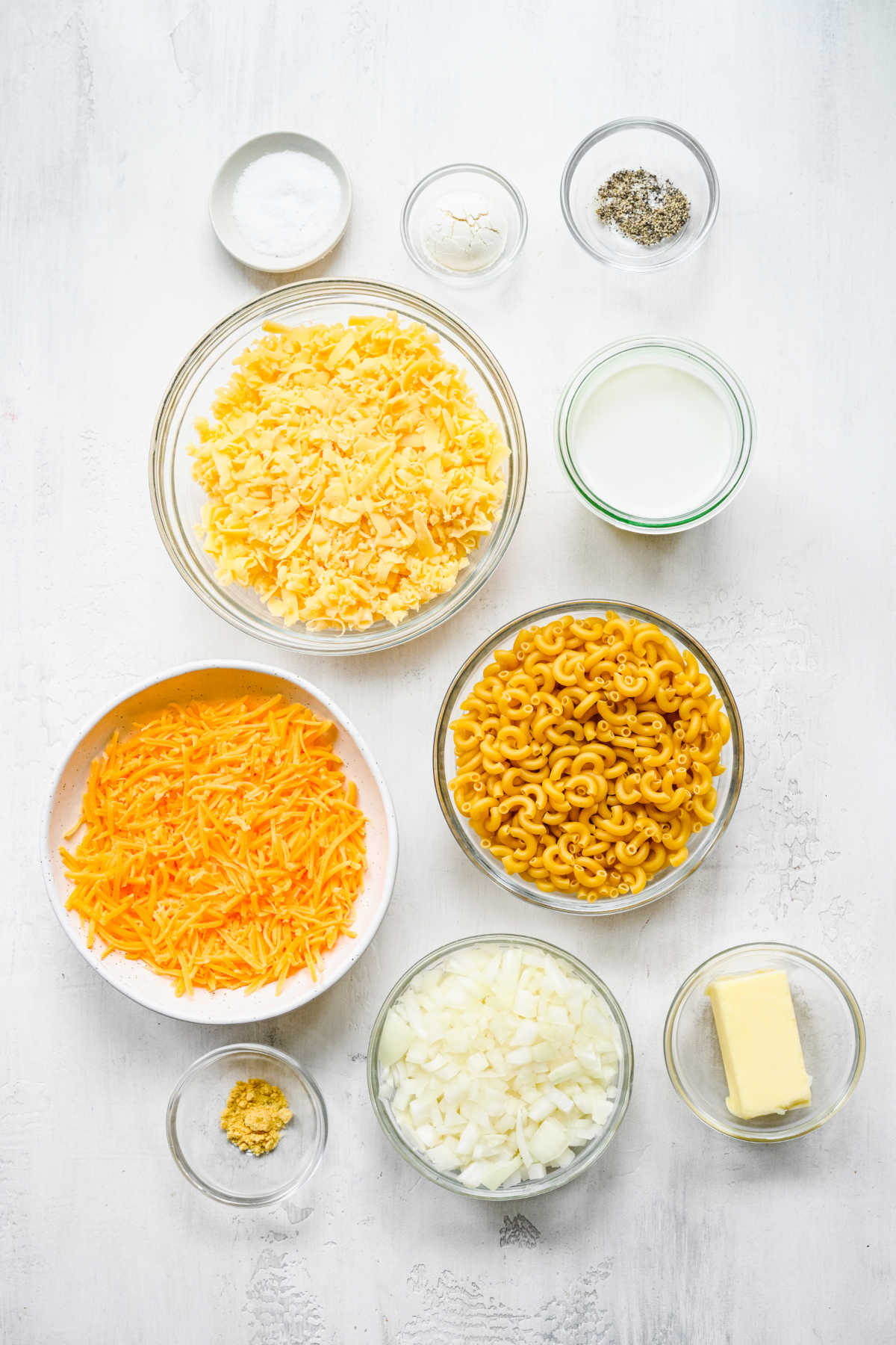 Ingredients for gouda mac and cheese in dishes. 