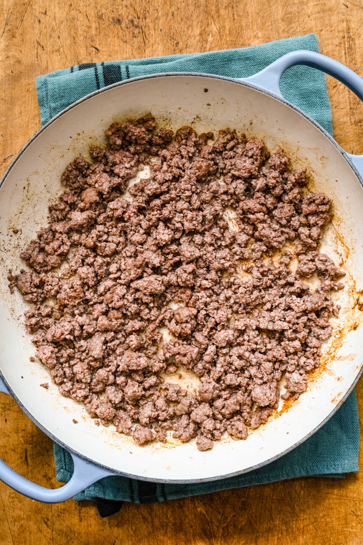 Cooked ground beef in a Dutch oven. 