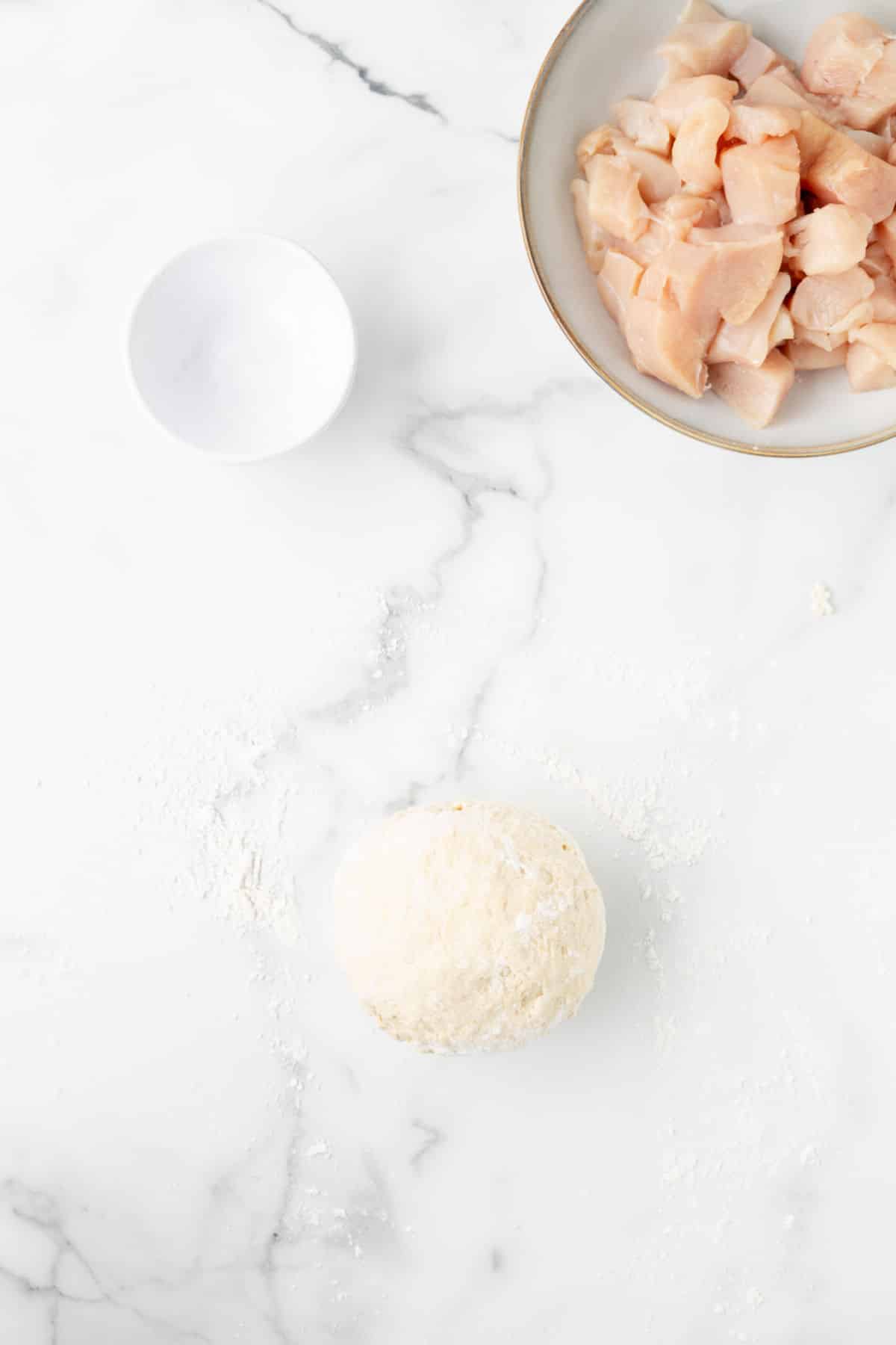 Kneaded dough on a marble background.
