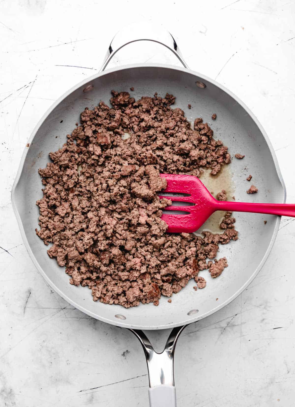 Ground beef in a skillet. 
